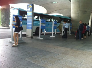 people standing in a bus station