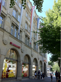 a building with flags on the front