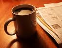Noticias y tacita de café.