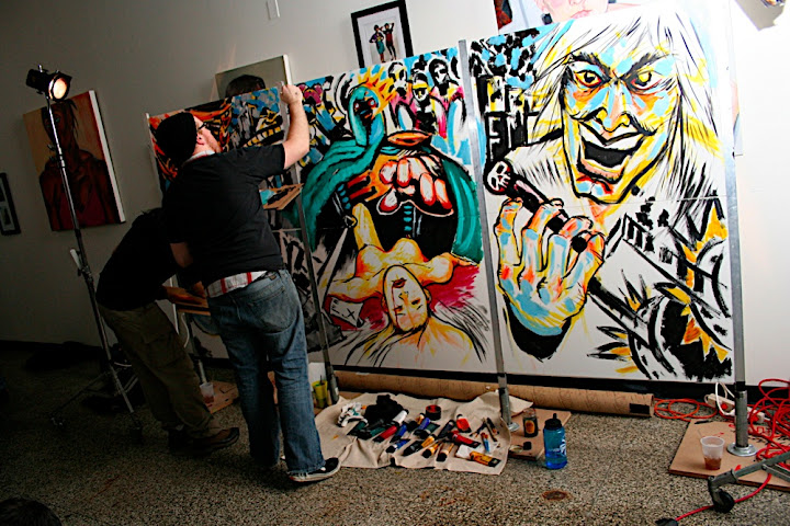 Jami and Nick rocking out the canvas, which SAF plans to sell on eBay. (Photo by the Baltinerd)