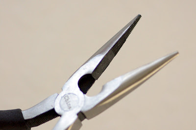 Pliers with teeth in jaws