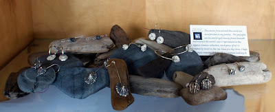 Sherry Cordova Jewelry earrings on an improvised display using local materials