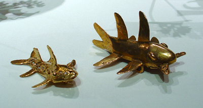 Gold shark pendants on display at the Metropolitan Museum of Art