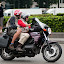 Photographer on motorcycle