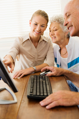 Find the right online lender for you in no time. A young lady assisting an elderly couple on the computer.