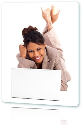 Woman lying down applying for payday loans on a white laptop.