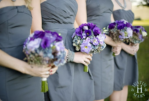  purple white lisianthus look great against smoky grey blue dresses 