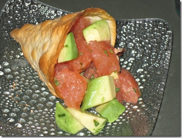 Grapefruit and avocado salad in a semolina cracker cone