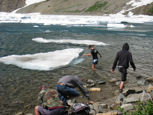 Random girl decides to wade out and stand on ice block.