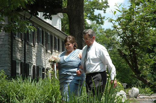 Jodi and father make the walk.