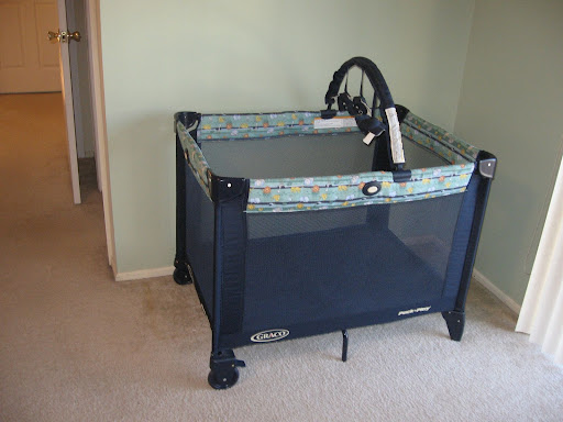 graco playyard with pink skirt