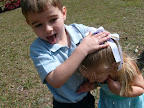 Tanner Dibbley excitedly crushes an egg over the head of his sister, Alexis. Easter 2008.