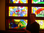 Sally Duhon and the "Caring for the Sick and Visiting the Prisoner" stained glass window dedicated to the memory of Joseph Duhon