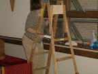 Mitzi George preparing the windows for installation of the stained glass.
