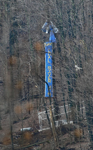 Up-close view of the tree sitters, showing the truck that holds the sound equipment