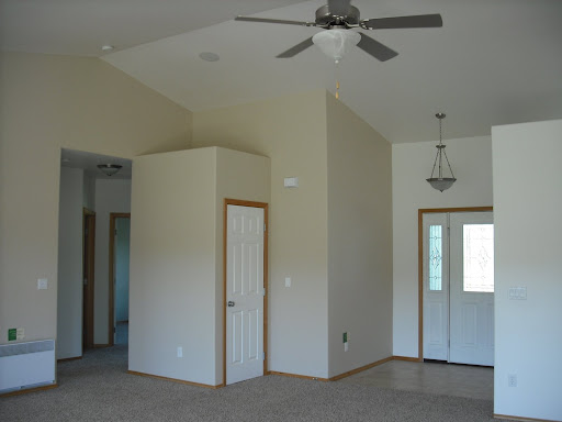 Looking from back sliding door back at (left to right) hall, closet, and front door (Kitchen is just out of sight to the right)