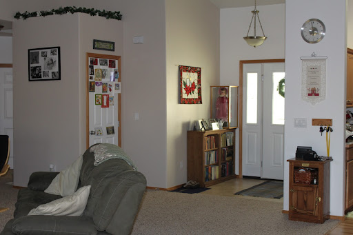 Wider view of the entry (kitchen on right, hallway to bedrooms on left)