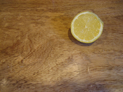 Sunny lemon on a cutting board