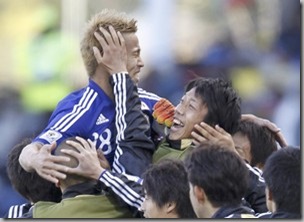 Japan's Keisuke Honda celebrates Winning