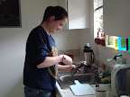 Cleaning her first fish.
