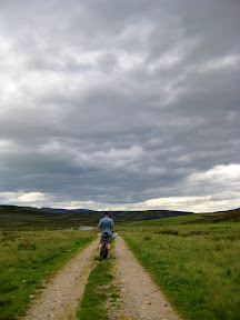 todd's assessing the map.  before day four, todd managed to upgrade his iphone to 4.0, download and cache all of the scotland trail maps, and get a few navigation apps on just a single bar of sporadic bed and breakfast wifi.  if we do anything similar to this again, we're bringing our own up-to-date gps and preloading the trails in advance.