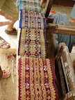 It takes two full days weaving to produce one band of woven silk.