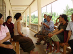 Souly and the village women discuss the micro-credit program