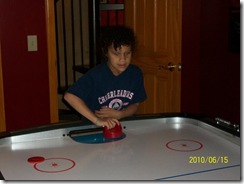 Sydney playing Air Hockey