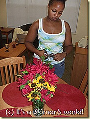 Amber adds some more personal touches to the common living area of her suite.