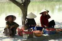 Sellers offering their wares on Thu Bon river, with minimum effort.