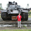 Lynette in front of an M48 tank, supplied to and captured from the South Vietnamese on March 25th 1975.