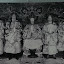 Emporer Khai Dinh and his four highest ranking officials. The guy on his far right scares us.