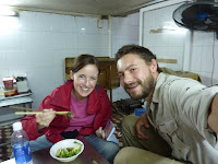 Lynette and I enjoying a bowl of ground eel sausages... yum!