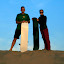 Chris and Lynette, demonstrating the best way of managing to stand upright with a sandboard.