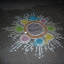 During Diwali, female members of the family draw a 'Kolam' outside their home using rice powder.