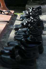Virtually all temples require you to take your shoes off. To avoid confusion, avoid black leather shoes...