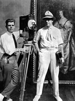 Old photo of two men with silent movie camera