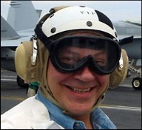 Tancredo in flight helmet and goggles