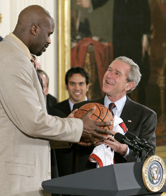 Shaquille O'Neal towers over George W. Bush