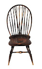 braced bowback side chair with worn brown paint