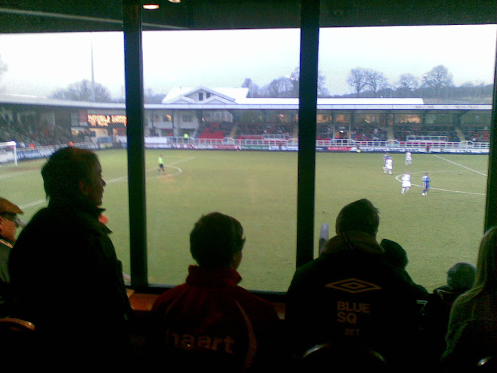 Burge looks on with other players, says our photographer.
