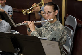 Staff Sgt. Katherine Fults, a flutist with 34th Red Bull Infantry Division Band, plays her instrument during a rehearsal at Contingency Operating Base Basra Aug. 25. Fults, a resident of Burnsville, Minn., teaches third grade at Ascension School in Minneapolis. (U.S. Army photo by Sgt. Frank Vaughn)