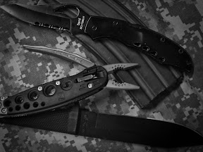 Soldiers and outdoorsmen have been using the three-knife system, comprised of one fixed blade, one folder and one multi-tool, for generations. Photo by Staff Sgt. Dave Lankford