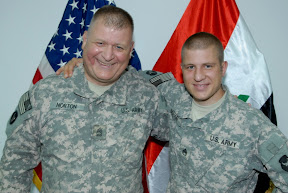 Sgt. 1st Class Michael Norton (left), operations noncommissioned officer-in-charge of the engineer cell of 34th Red Bull Infantry Division, serves with his son, Staff Sgt. Christopher Norton, ammunition noncommissioned officer for 34th ID, in support of Operation Iraqi Freedom. Michael also taught his son in high school prior to their service together in the Minnesota National Guard. (U.S. Army photo by Sgt. Frank Vaughn)