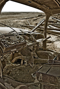 This old truck rests outside Contingency Operating Base Adder. She keeps a quiet vigil over the Iraqi-Based Industrial Zone across a quiet field right outside the gate. A look through her eyes may have revealed a little more than expected. (U.S. Army photo by Staff Sgt. Derek M. Smith)