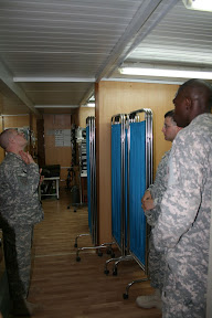 Sgt. Garrett E. Poole, noncommissioned officer-in-charge of the Forward Operating Base Husayniya aid station instructs Soldiers on proper head tilt to open airways for a patient. Training is also important for U.S. Soldiers and the brigade places emphasis on the Blackhawk First Responders certification, which trains Soldiers on more skills than a certified combat lifesaver class. The medical staff provides classes for the brigade Soldiers stationed here. (U.S. Army photo by Capt. Stephen C. Short)