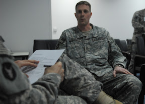 Sgt. 1st Class Andrew Peterson, native of St. Paul, Minn., operations noncommissioned officer in charge with the 34th Infantry Division Tactical Command Post, answers why he should be the next vice president during a mock interview. Classes on job seeking, interviewing techniques, and resume writing are being offered on Contingency Operating Base Basra, Dec. 30 through Jan 7.(U.S. Army photo by Spc. Samuel Soza)