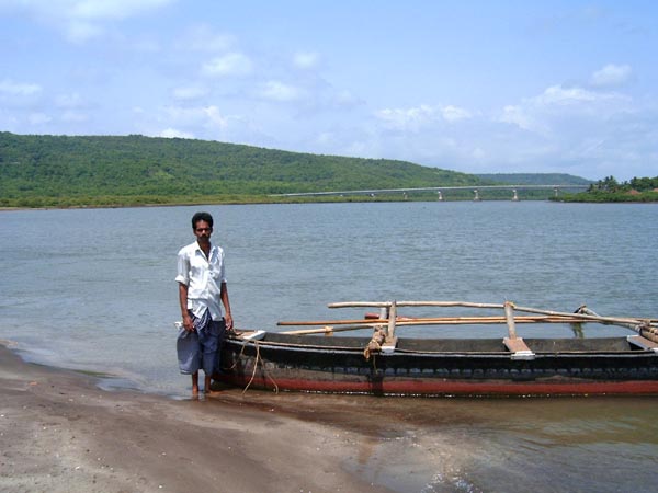 Boatman and his boat at Harne beach Boatman and his boat at Harne beach