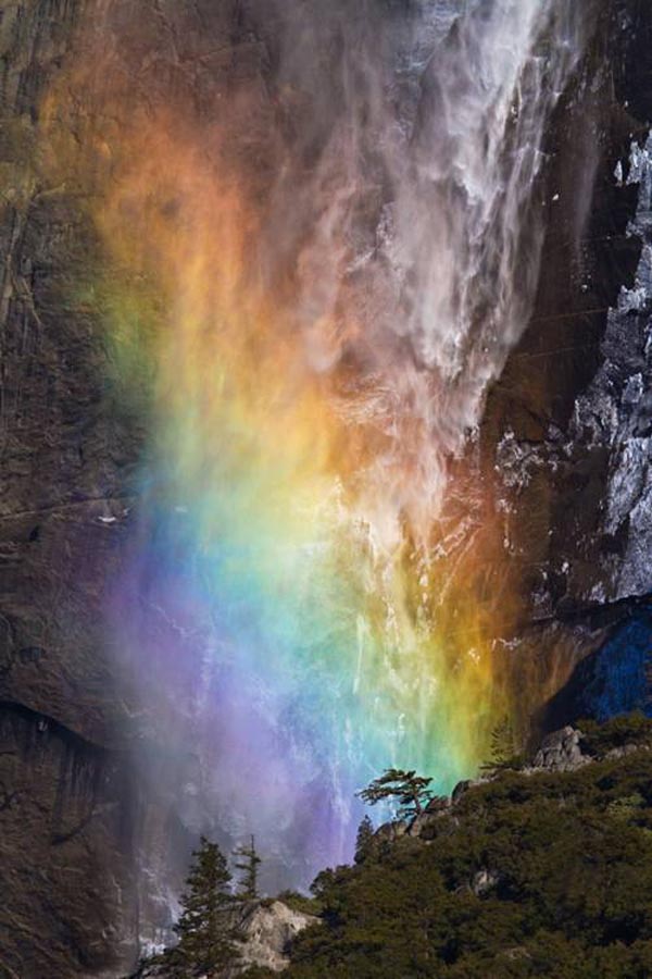 Rainbow with a waterfall at Yosemite National Park