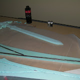 Adding fiberglass resin to seal reinforcement rods to the inside of the blade.  With 36" Master Sword for size reference.